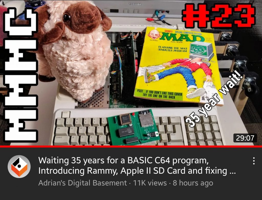 A title card from YouTube of an episode of Adrian's Digital Basement, featuring an old edition of Mad Magazine, a circuit board and a plush ram toy.